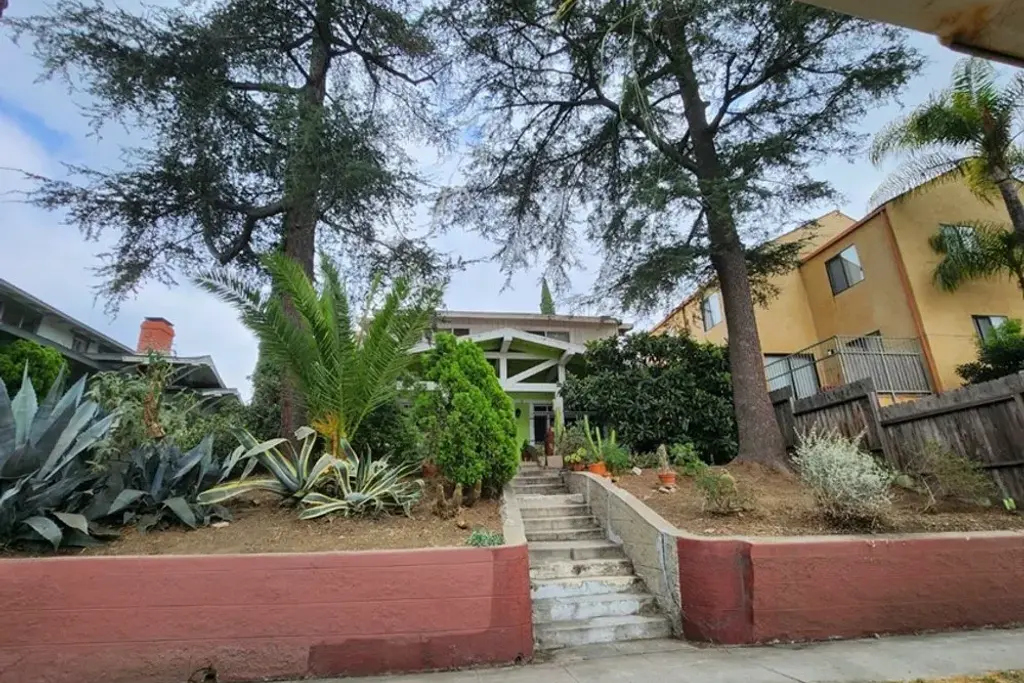 Entry steps and succulent planting at a two story multi family residential building