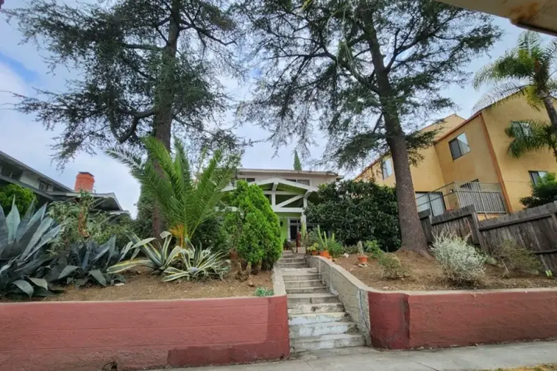 Entry steps and succulent planting at a two story multi family residential building